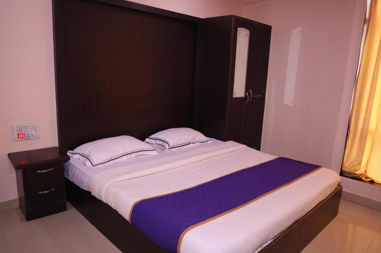 Smilestay Bns Lodge Bangalore Bagian luar foto